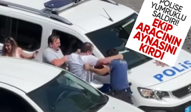 İzmir'de polise yumruklu saldırı: Ekip aracının aynasını kırdı